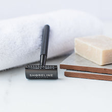 Load image into Gallery viewer, Closeup of matte black metal safety razor with natural shaving soap - Shoreline Shaving