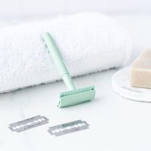 Load image into Gallery viewer, Mint green safety razor with loose DE blades and white shaving cloth - Shoreline Shaving
