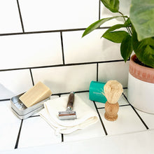 Load image into Gallery viewer, Travel soap tin with shaving soap, safety razor, blade tin and shaving brush on bathroom tiles - Shoreline Shaving
