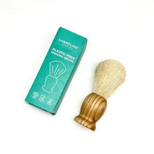 Load image into Gallery viewer, Plastic-free and vegan-friendly shaving brush with wooden handle, lay down next to a teal box for the brush - Shoreline Shaving