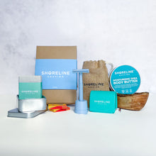 Load image into Gallery viewer, Women's grooming bundle with pale blue safety razor, matching stand, blade bank, wooden soap dish, natural moisturiser and more shaving accessories - Shoreline Shaving