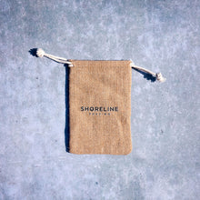 Load image into Gallery viewer, Drawstring hessian travel bag for plastic free razor on a grey background - Shoreline Shaving