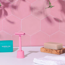 Load image into Gallery viewer, Pink safety razor in matching razor stand with teal blade bank and natural shaving soap bar - Shoreline Shaving
