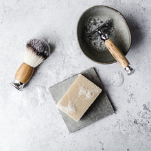 Load image into Gallery viewer, Natural shaving soap lathered up with safety razor and shaving brush - Shoreline Shaving

