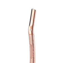 Load image into Gallery viewer, Closeup of rose gold dermaplaner showing the blade head, logo and detail on handle - Shoreline Shaving
