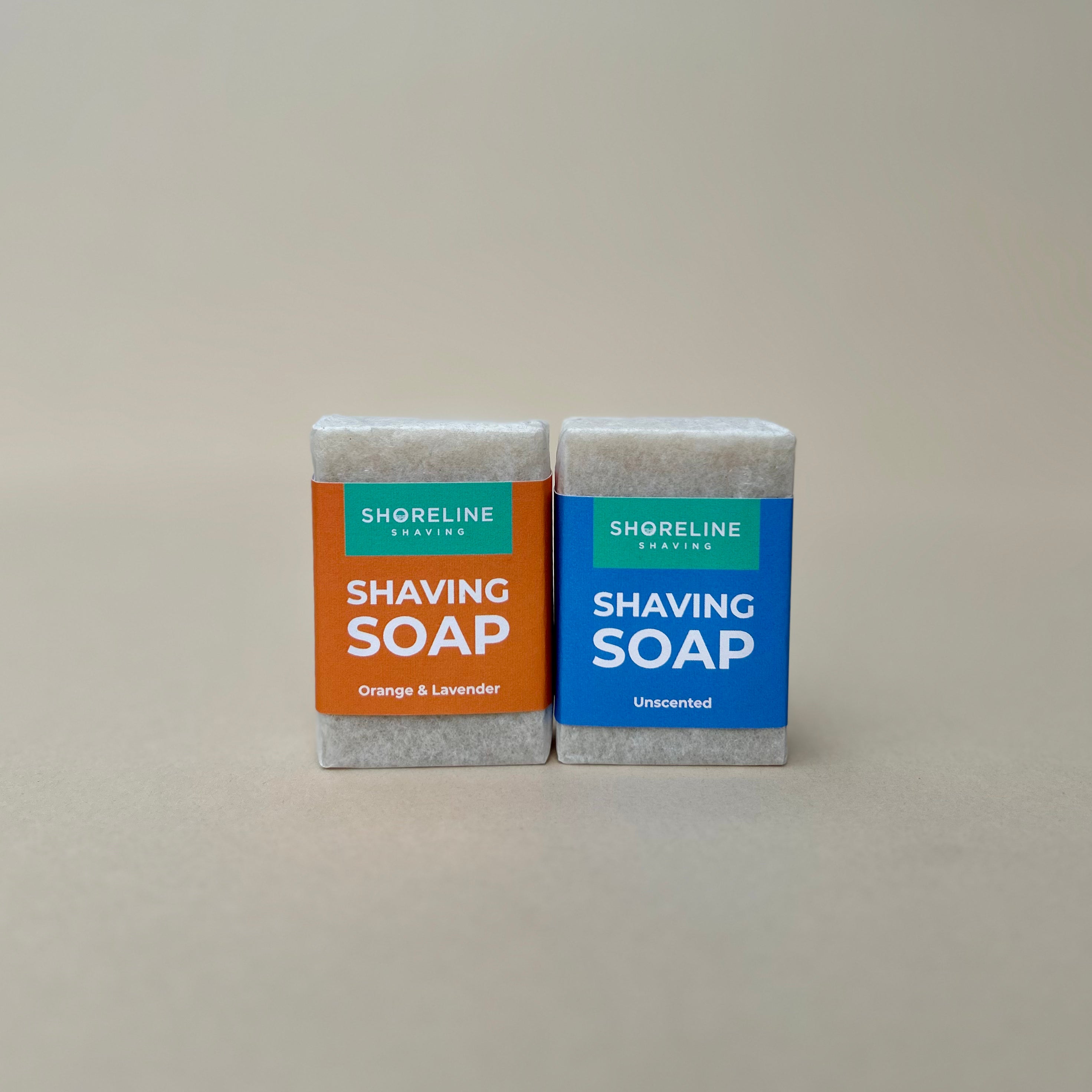 Two natural shaving soaps next to each other on a nude background  - Shoreline Shaving