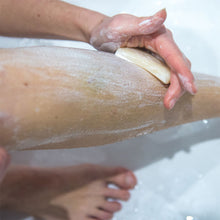 Load image into Gallery viewer, Natural soap bar being applied to a woman&#39;s leg, ready for shaving - Shoreline Shaving
