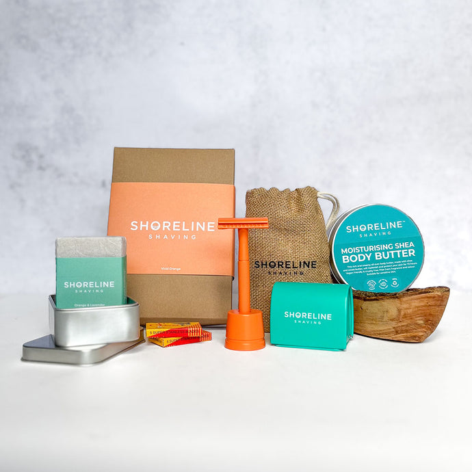 Women's grooming bundle with vivid orange safety razor, matching stand, blade bank, wooden soap dish, natural moisturiser and more shaving accessories - Shoreline Shaving
