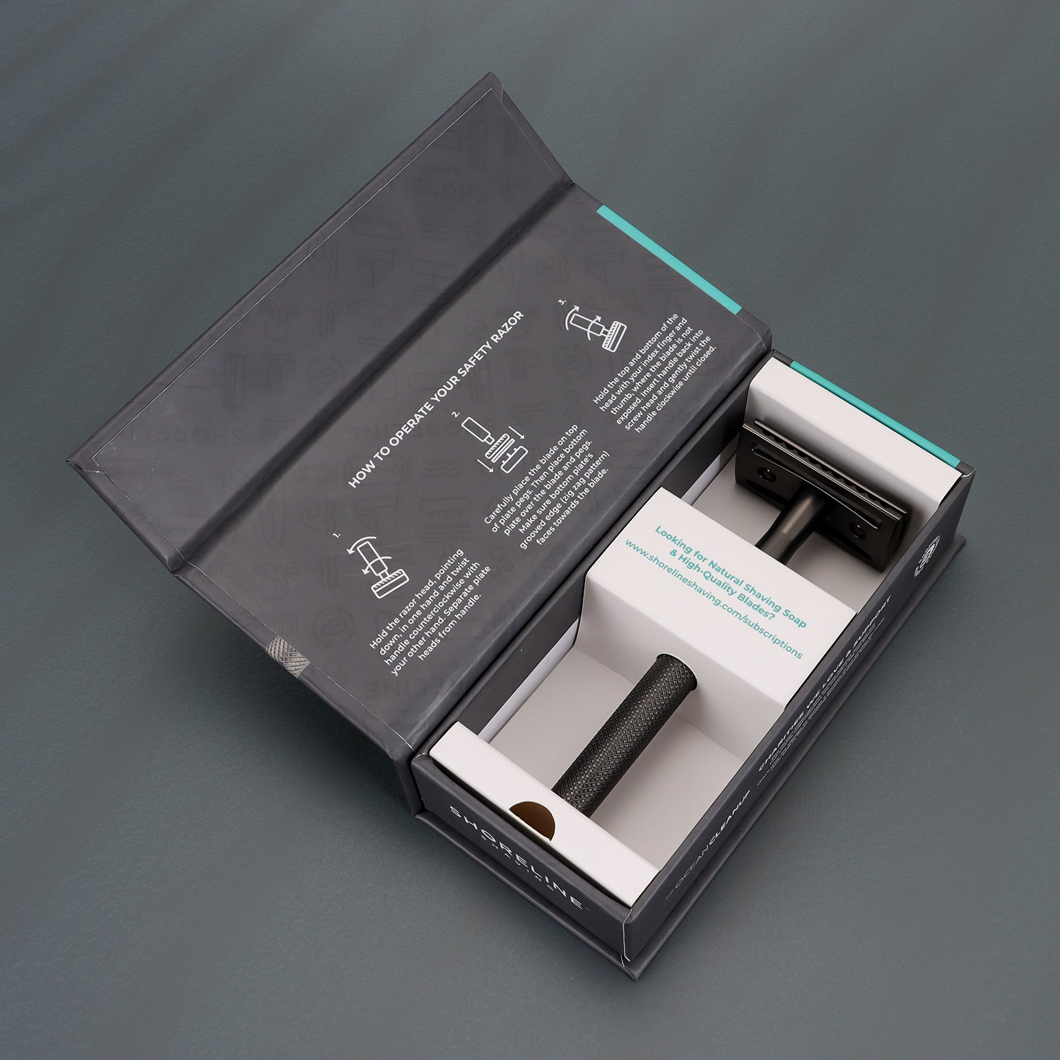 An open matte black safety razor box displaying the safety razor and operating manual - Shoreline Shaving