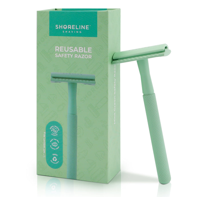 Mint Green safety razor for women & men, leaning upright against the packaging box with a white background - Shoreline Shaving