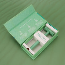 Load image into Gallery viewer, An open mint green safety razor box displaying the safety razor and operating manual - Shoreline Shaving
