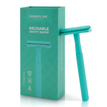 Load image into Gallery viewer, Teal safety razor for women &amp; men, leaning upright against the packaging box with a white background - Shoreline Shaving
