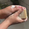 Shaving soap bar being lathered up in a bathroom ready for shaving - Shoreline Shaving UK