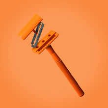 Load image into Gallery viewer, Double-edged orange safety razor made from metal, part of the eco-friendly travel set - Shoreline Shaving
